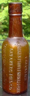 Click to see enlargement of August raffle bottle